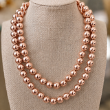 Bold 10mm rose gold bead necklace featuring polished high-shine rose gold beads.