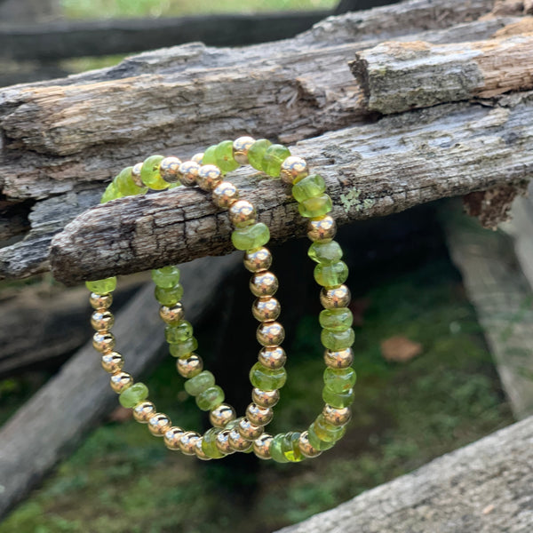 Peridot rondelle beads featured with gold fill.